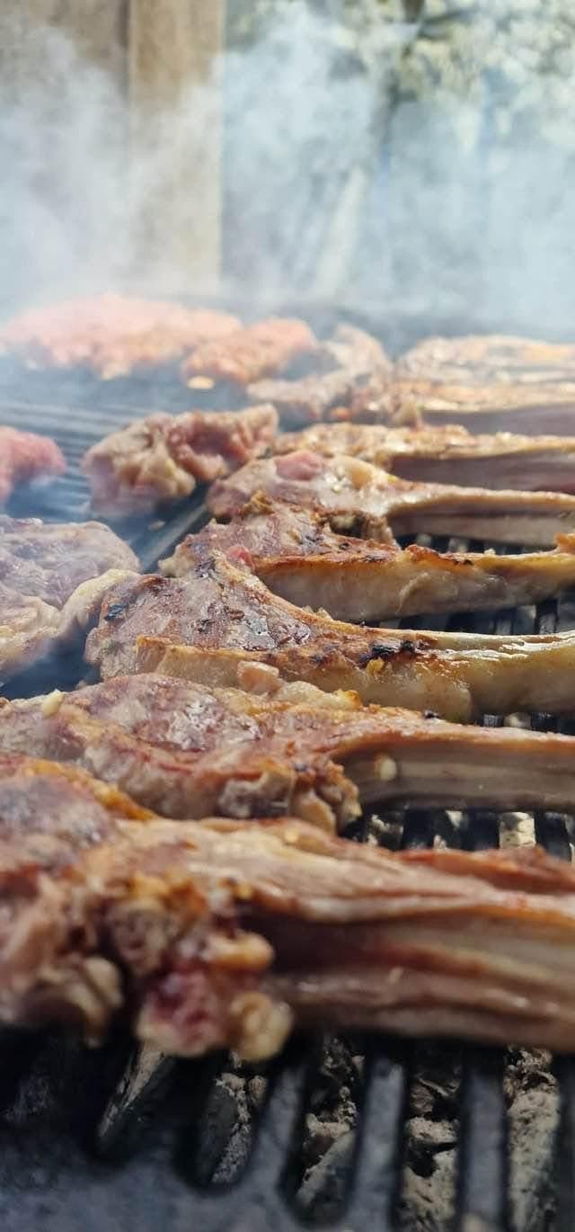 Meat on the charcoal grill, smoke rising