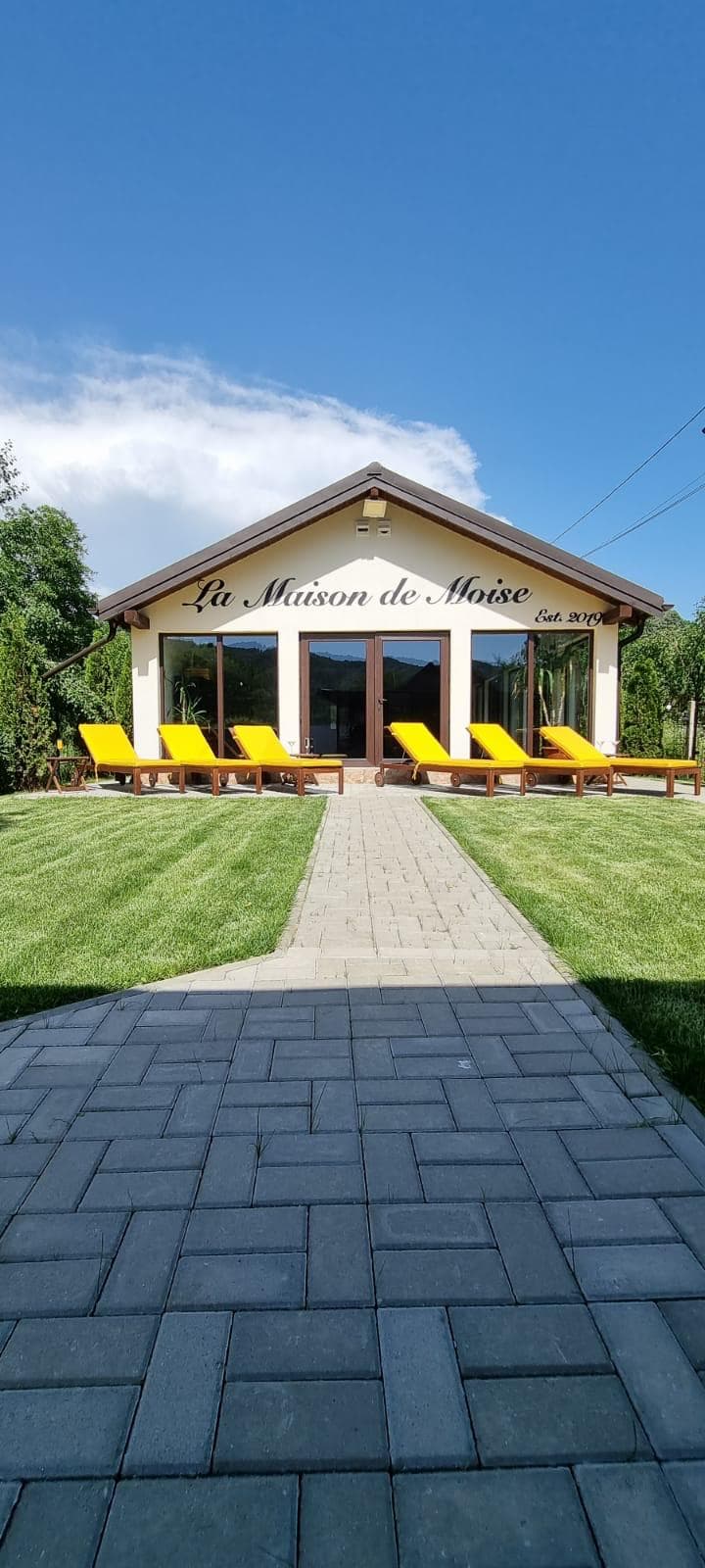 The La Maison de Moise house, with the path and the front garden