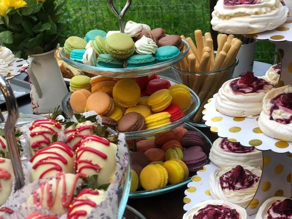 A table of homemade desserts, cakes and fruit