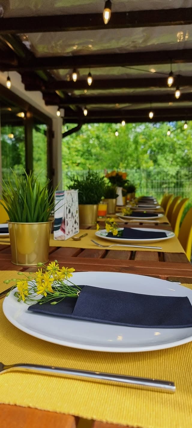 A table laid with cutlery and spring flowers
