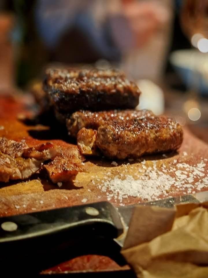 Grilled dishes, sliced on a wooden board